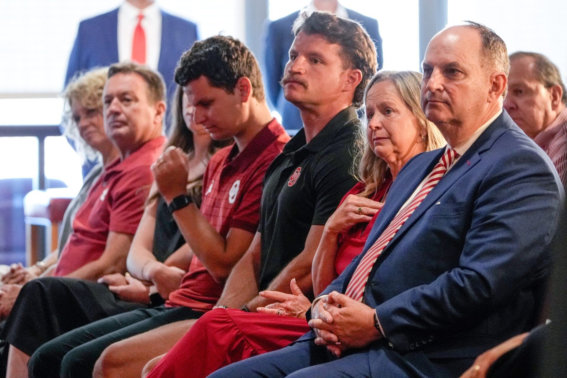 Oklahoma Athletic Director Joe Castiglione sits with his family during a press conference announcing his retirement at Gaylord Family Oklahoma Memorial Stadium in Norman, Okla., on Tuesday, July 8, 2025.