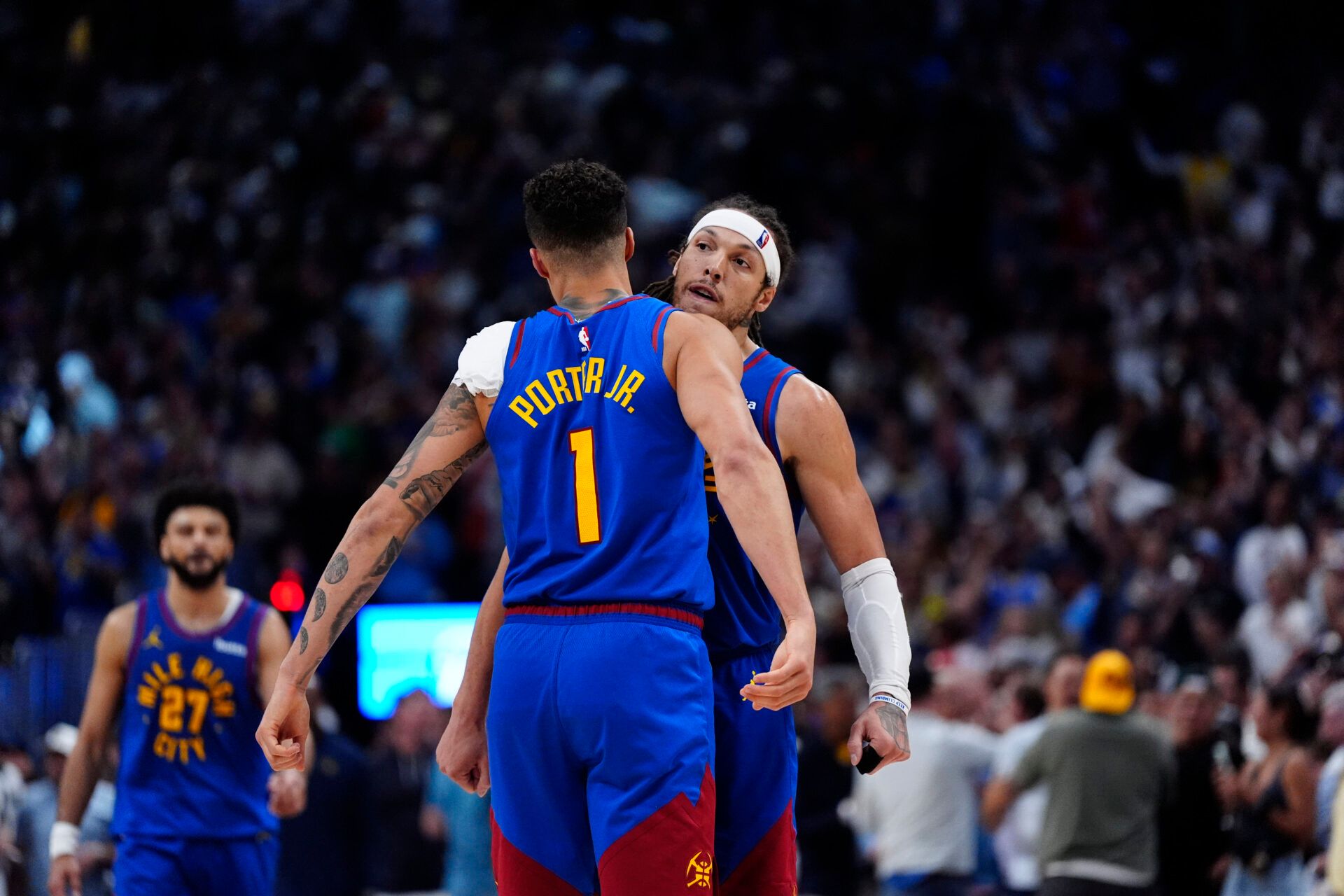 Denver Nuggets forward Aaron Gordon (32) celebrates his three point score with forward Michael Porter Jr. (1) in the fourth quarter against the Oklahoma City Thunder during game three of the second round for the 2025 NBA Playoffs at Ball Arena.