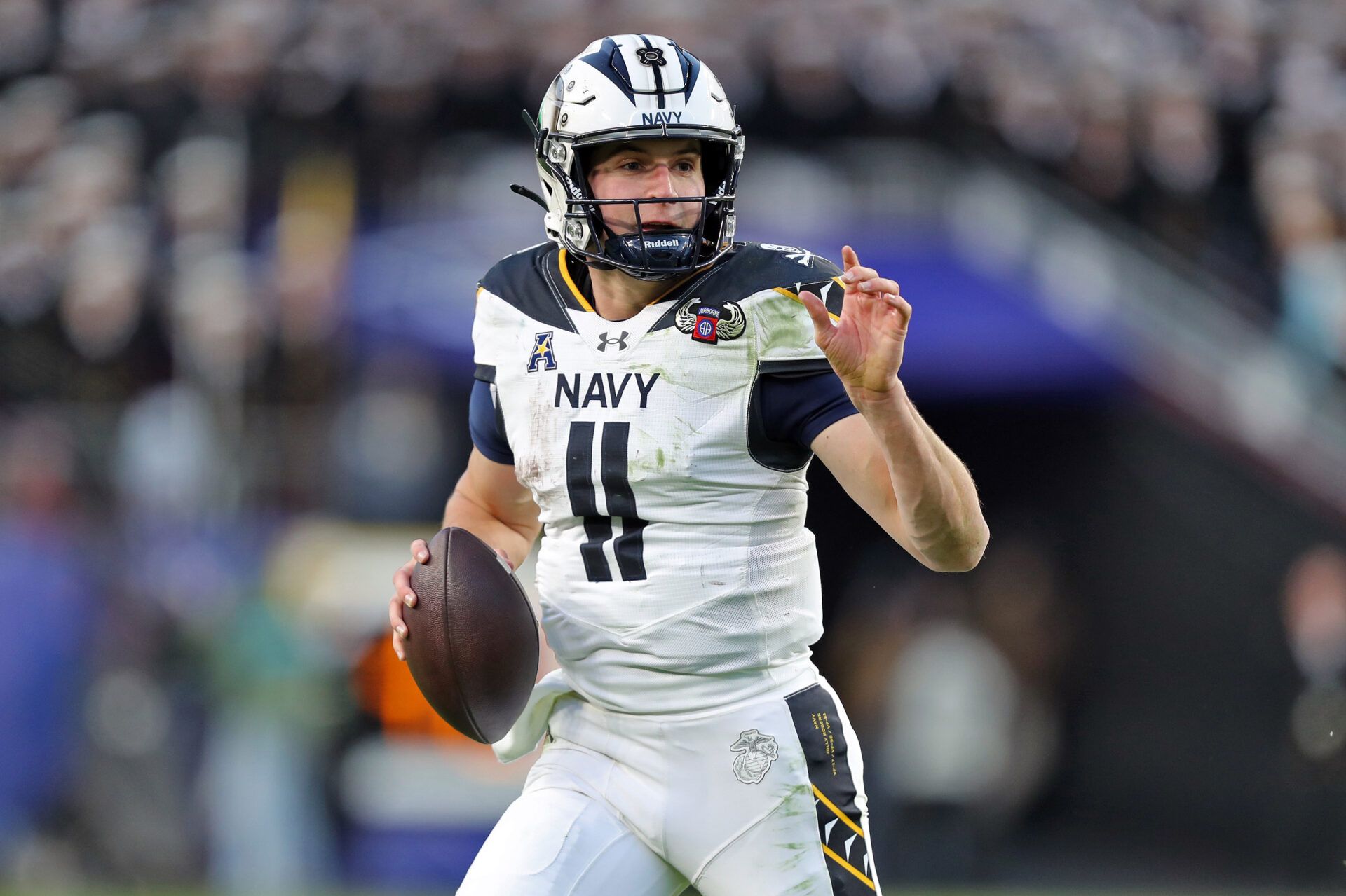 Navy Midshipmen quarterback Blake Horvath (11) looks to pass against the Army Black Knights during the first half of the the 125th Army-Navy game at Northwest Stadium.