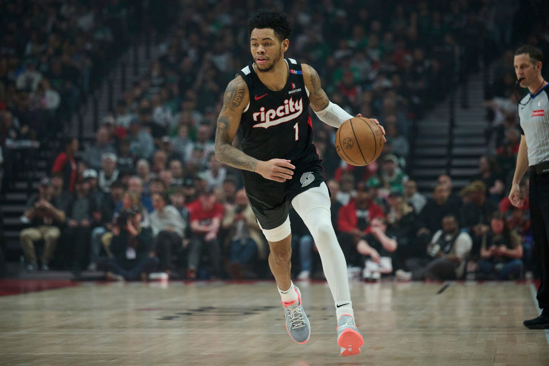 Portland Trail Blazers guard Anfernee Simons (1) dribbles the ball during the first half against the Boston Celtics at Moda Center.