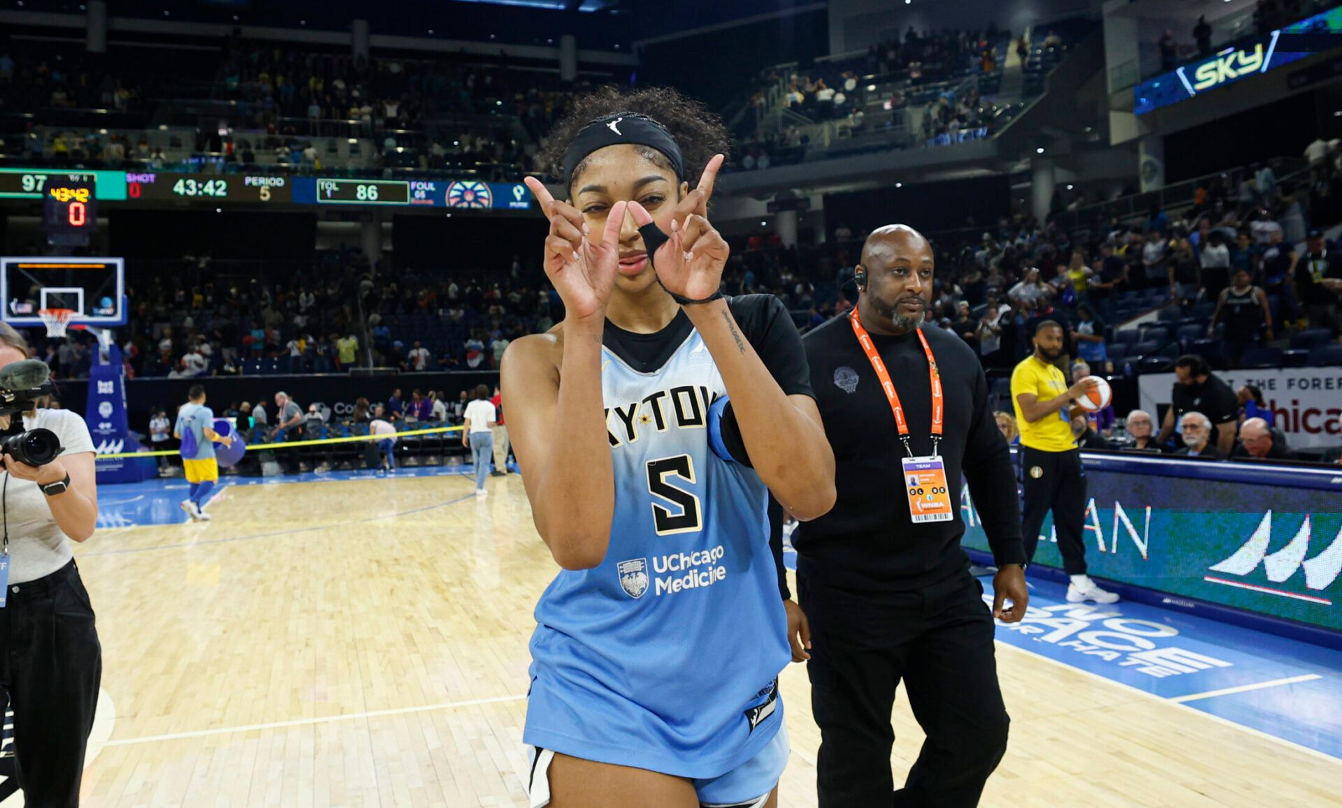 Chicago Sky forward Angel Reese (5) celebrates the team's win against the Los Angeles Sparks at Wintrust Arena.
