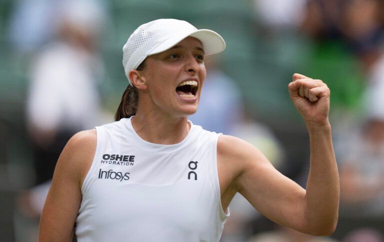Iga Swiatek of Poland celebrates winning her match against Liudmila Samsonova on day 10 at All England Lawn Tennis and Croquet Club.