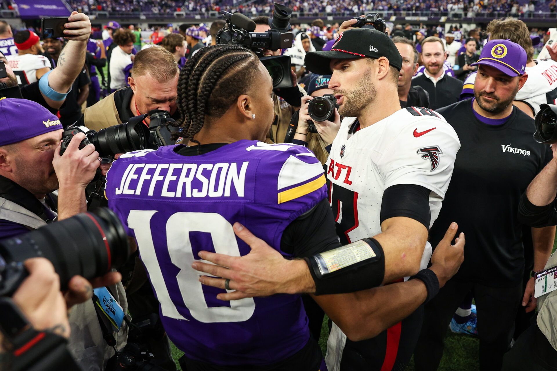 Minnesota Vikings wide receiver Justin Jefferson (18) and Atlanta Falcons quarterback Kirk Cousins (18) talk after the game at U.S. Bank Stadium.