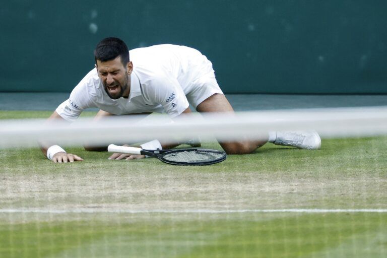 Novak Djokovic (SRB) takes a fall late in his match against Flavio Cobolli (ITA)(not pictured) in a gentlemen's singles quarter-final on day ten of these Championships Wimbledon 2025 at All England Lawn Tennis and Croquet Club.