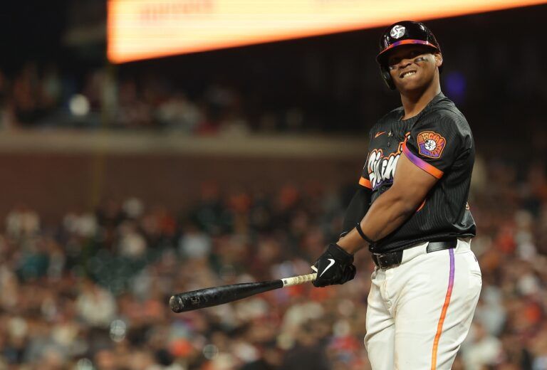 San Francisco Giants designated hitter Rafael Devers (16) reacts after a strike against the Philadelphia Phillies during the eighth inning at Oracle Park.