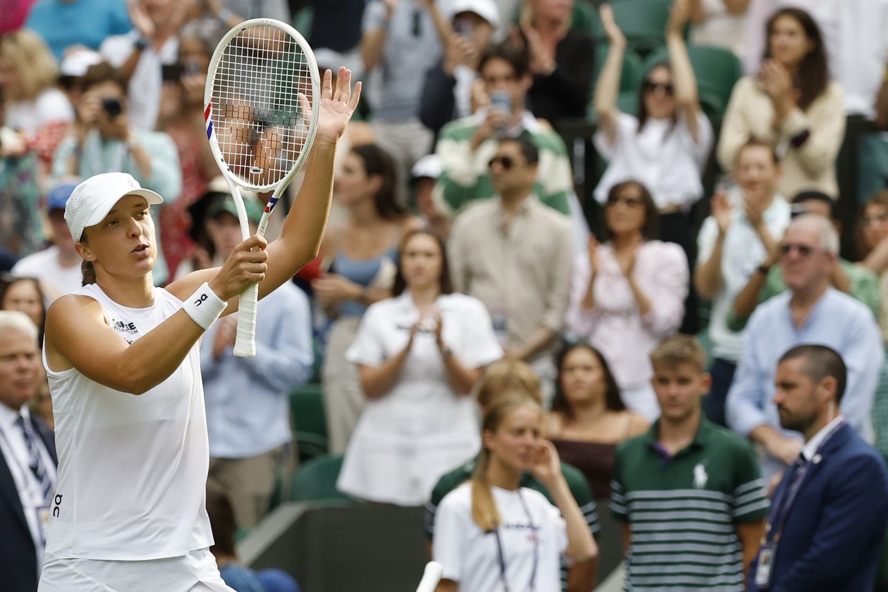 Iga Swiatek (POL) salutes the crowd after her match against Caty McNally (USA)(not pictured) on day four of The Championships Wimbledon 2025 at All England Lawn Tennis and Croquet Club.