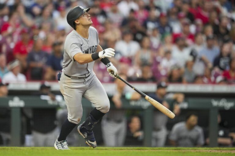 New York Yankees shortstop Anthony Volpe watches his RBI sacrifice fly ball against the Cincinnati Reds in the fifth inning at Great American Ball Park.