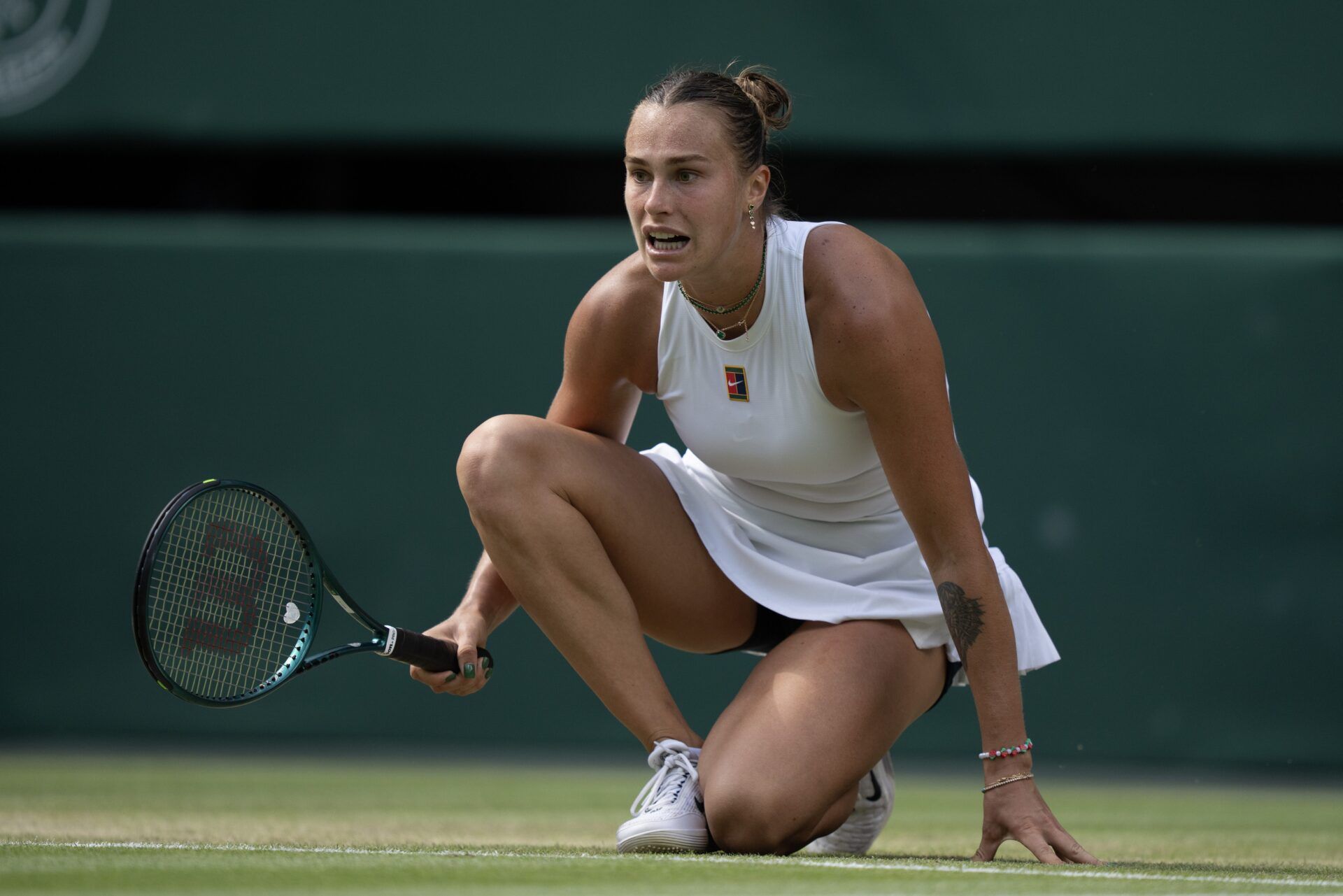 Aryna Sabalenka reacts to a point during her match against Amanda Anisimova of the United States on day 11 at All England Lawn Tennis and Croquet Club.