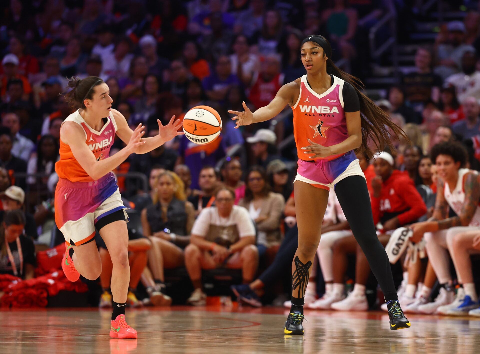 Team WNBA guard Caitlin Clark (left) and Angel Reese against the USA Women's National Team during the 2024 WNBA All Star Game at Footprint Center.