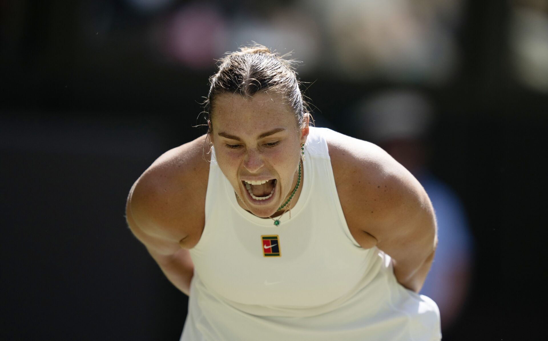 Aryna Sabalenka reacts to a point during her match against Amanda Anisimova of the United States on day 11 at All England Lawn Tennis and Croquet Club.