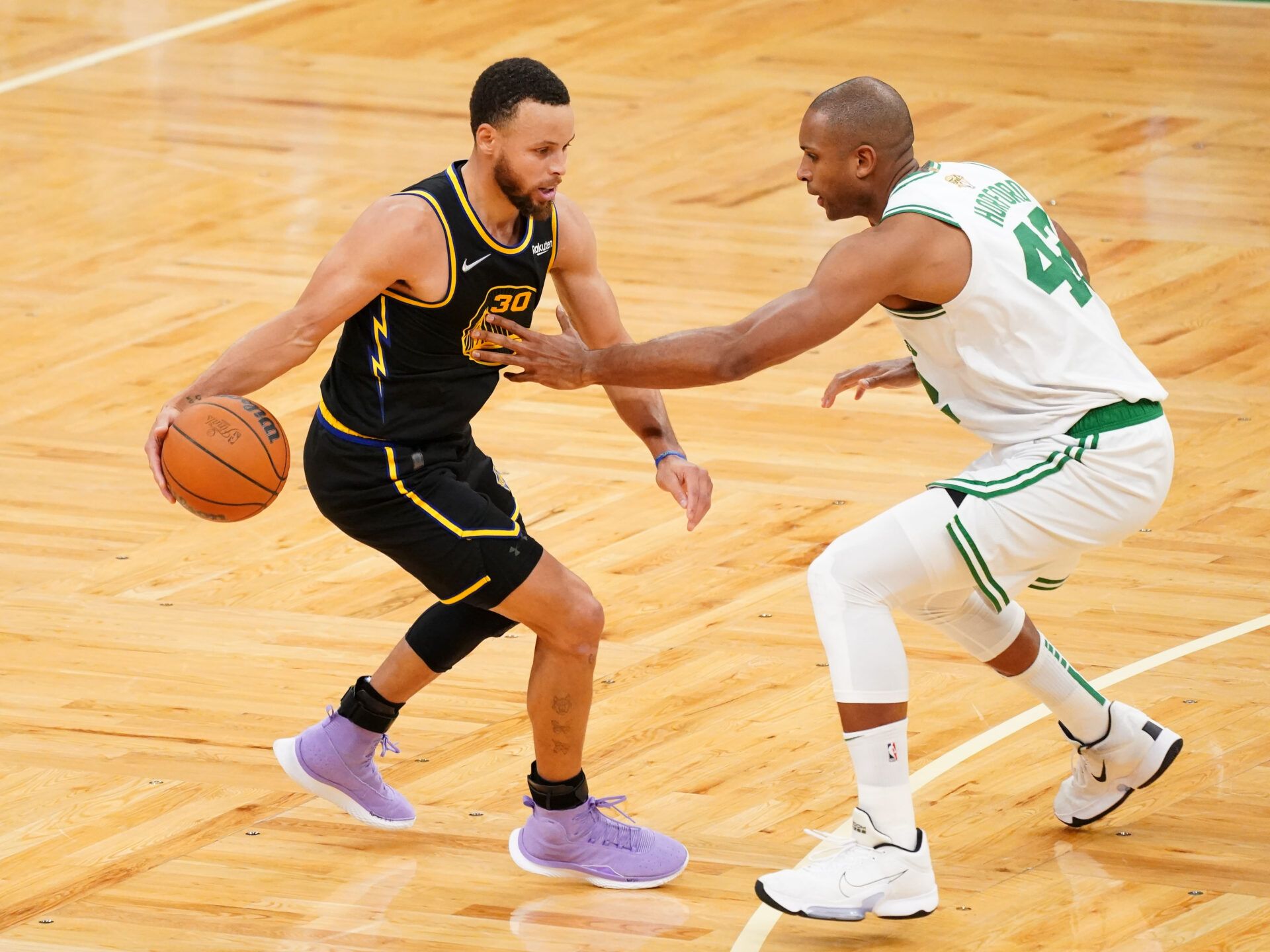 Boston Celtics center Al Horford (42) defends Golden State Warriors guard Stephen Curry (30) during the fourth quarter of game four in the 2022 NBA Finals at the TD Garden.
