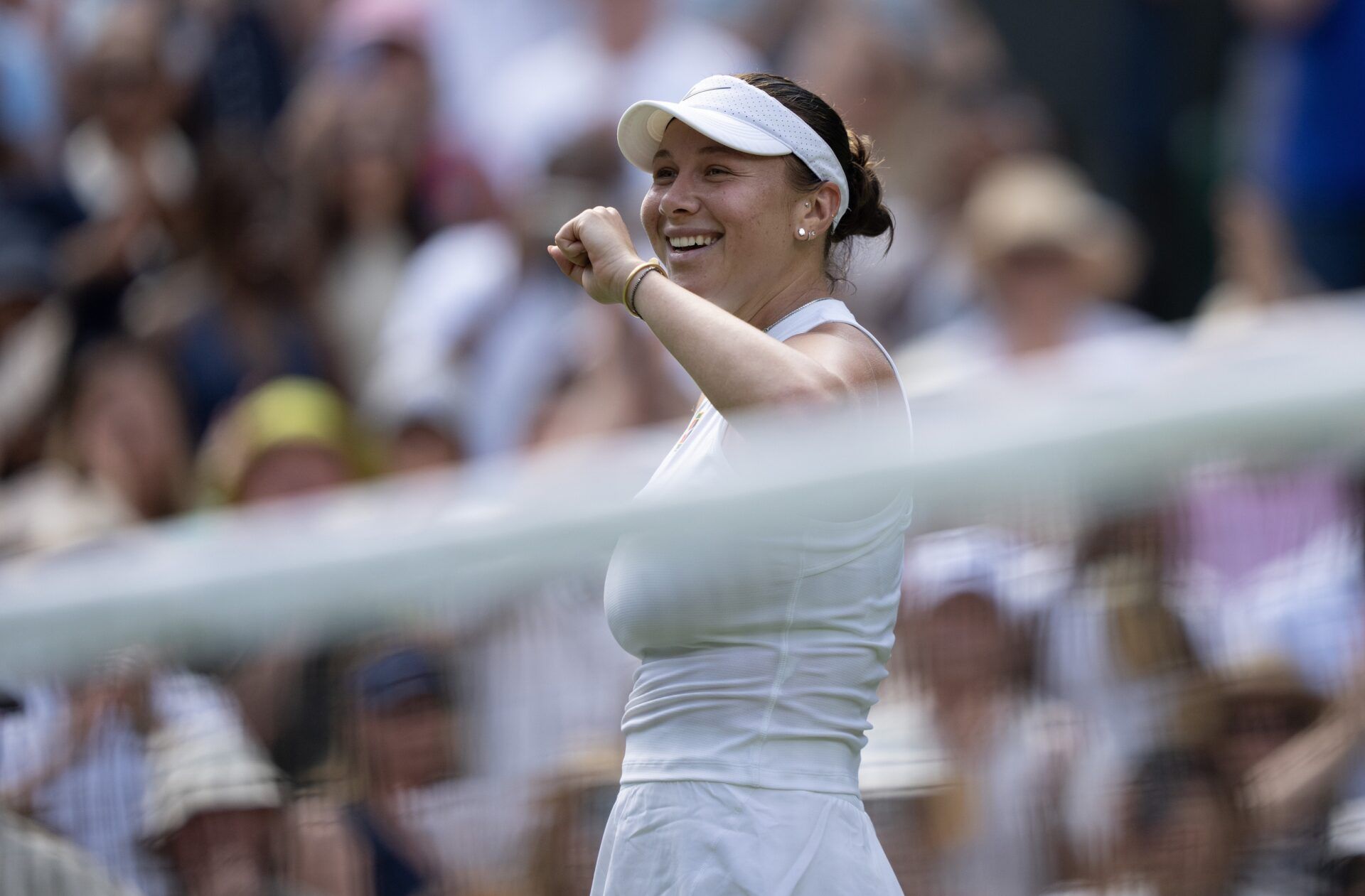 Amanda Anisimova of the United States celebrates winning her match against Aryna Sabalenka on day 11 at All England Lawn Tennis and Croquet Club.
