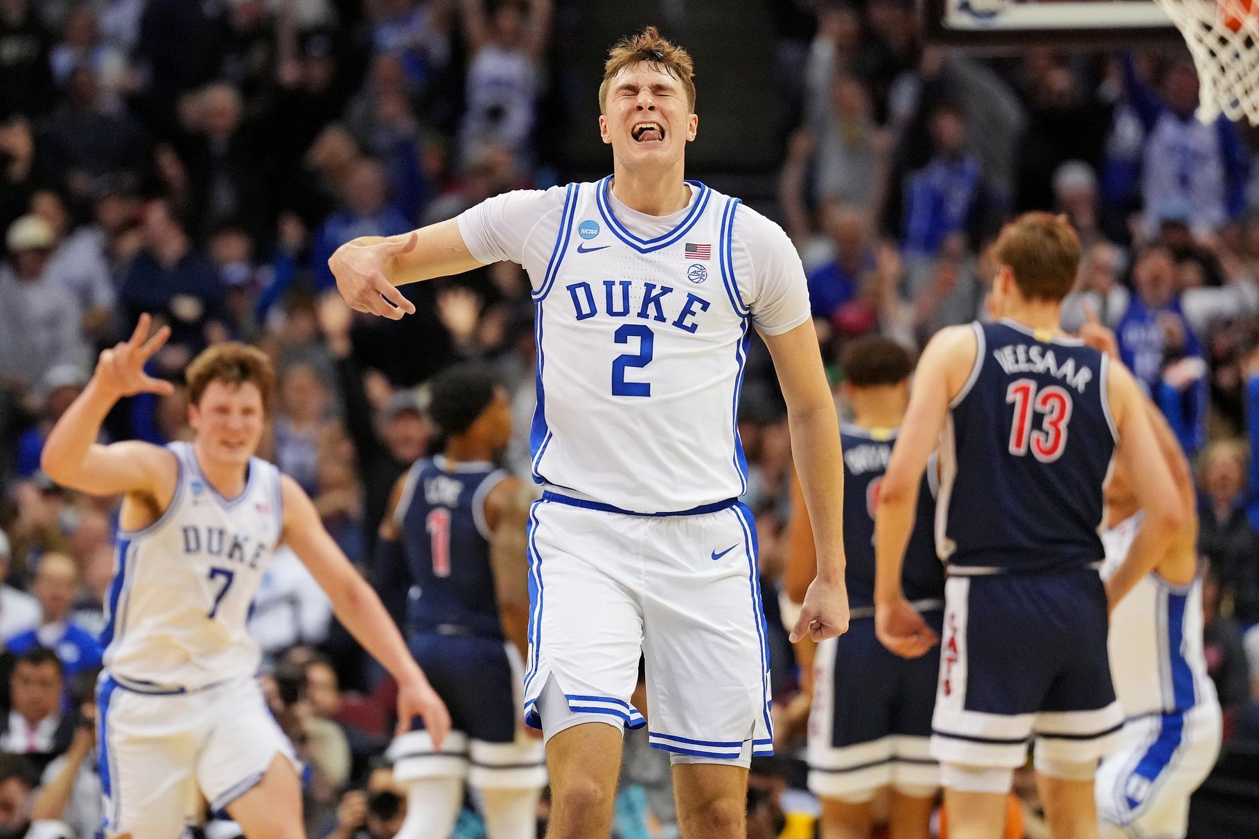 Duke Blue Devils forward Cooper Flagg (2) reacts after making a last second shot to end the first half against the Arizona Wildcats during an East Regional semifinal of the 2025 NCAA tournament at Prudential Center.