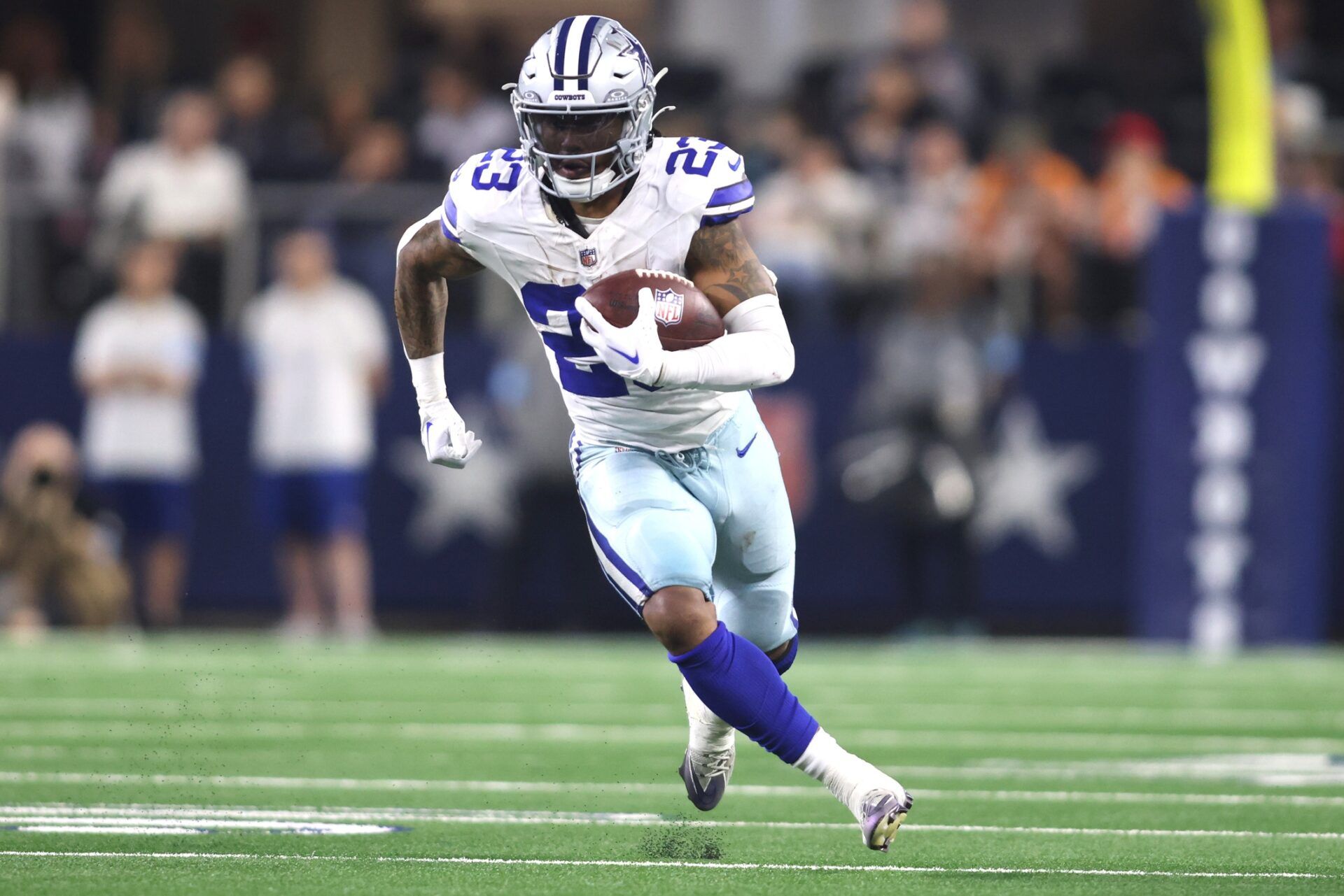 Dallas Cowboys running back Rico Dowdle (23) runs the ball against the Tampa Bay Buccaneers in the second half at AT&T Stadium.