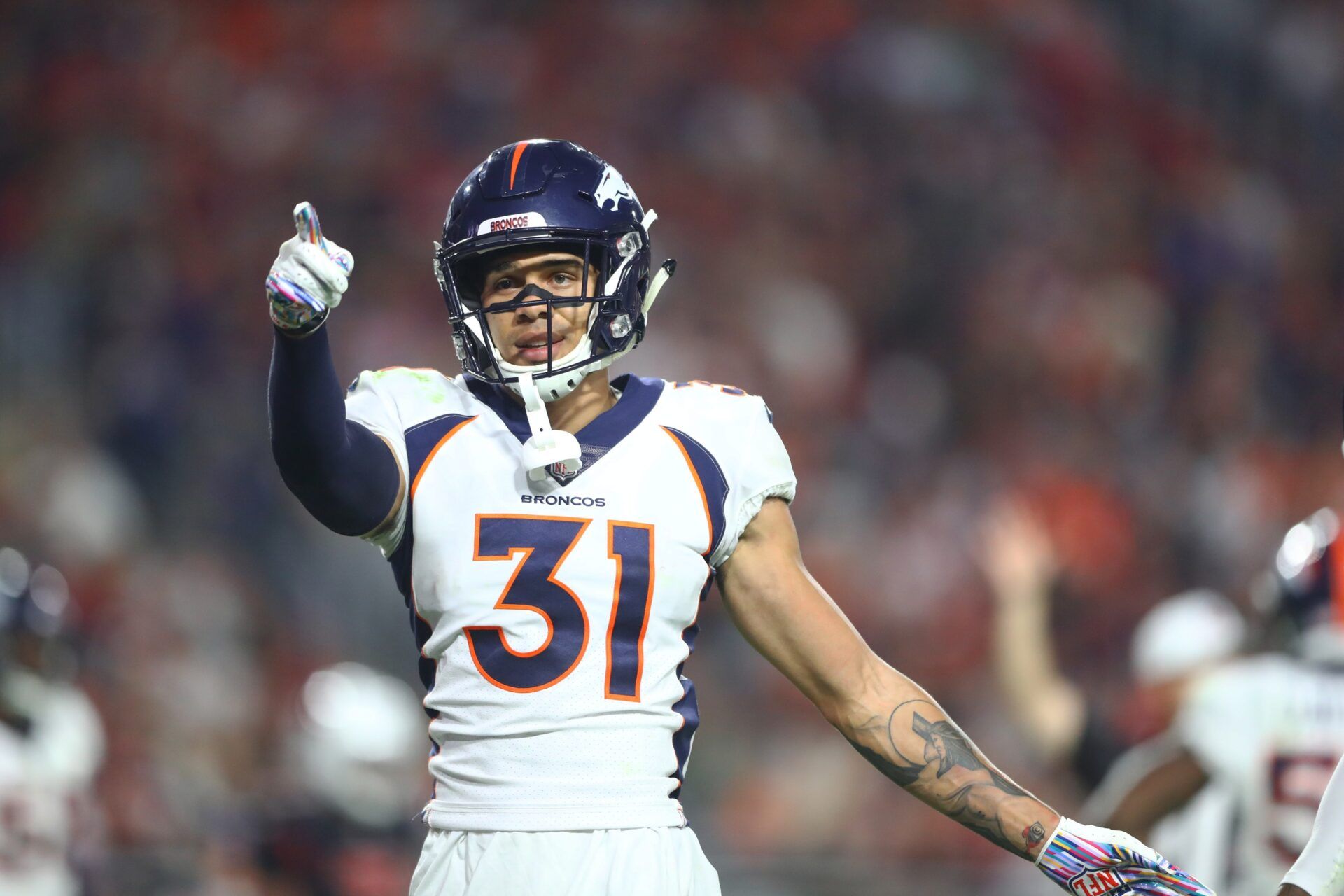 Denver Broncos safety Justin Simmons (31) reacts  against the Arizona Cardinals at State Farm Stadium.