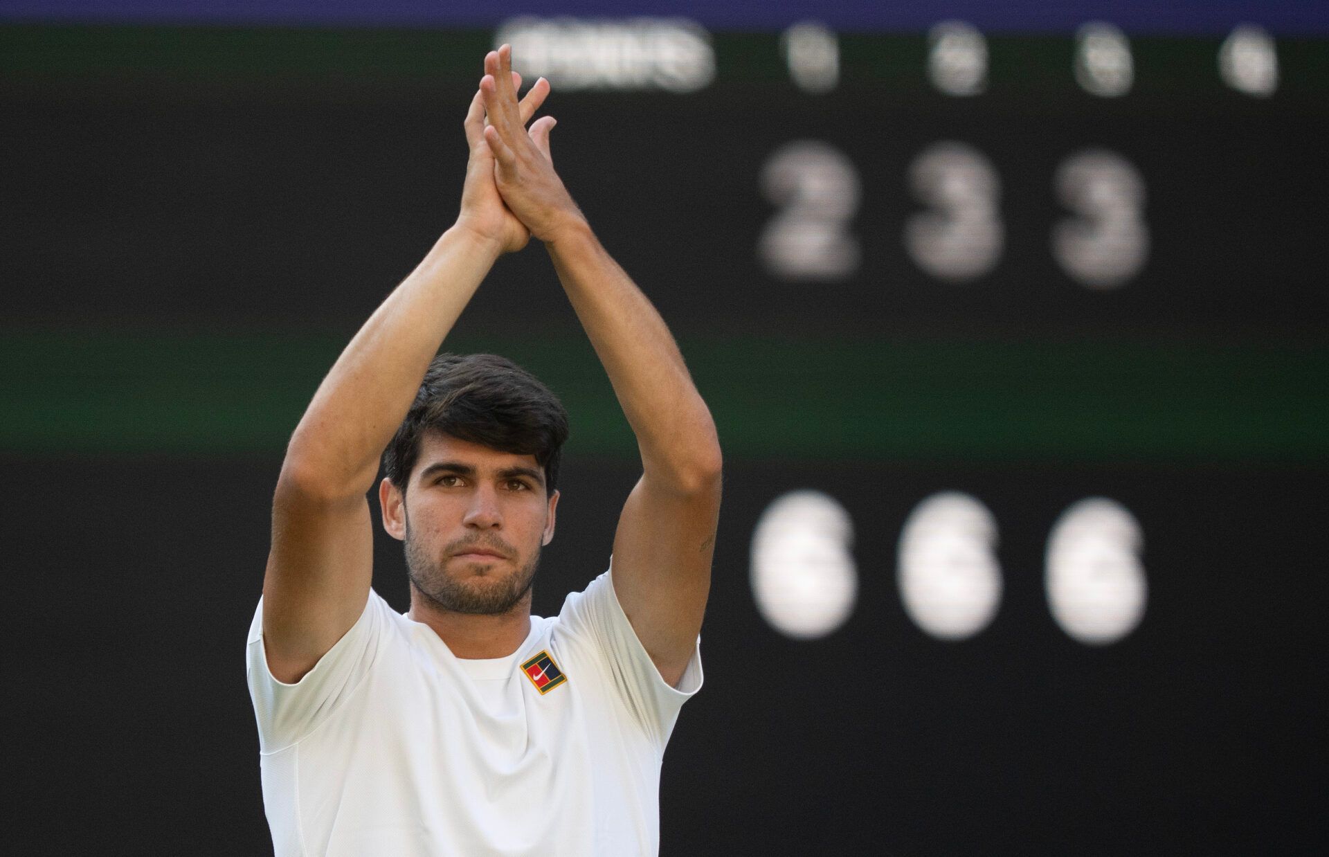 Carlos Alcaraz of Spain celebrates winning his match against Cameron Norrie of Great Britain on day nine at All England Lawn Tennis and Croquet Club.