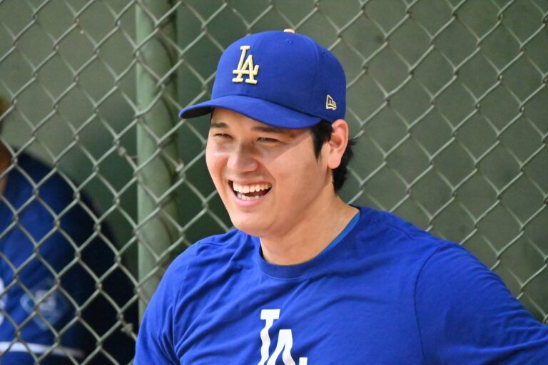 Los Angeles Dodgers pitcher Shohei Ohtani (17) smiles while warming up prior to a game against the Milwaukee Brewers at American Family Field.