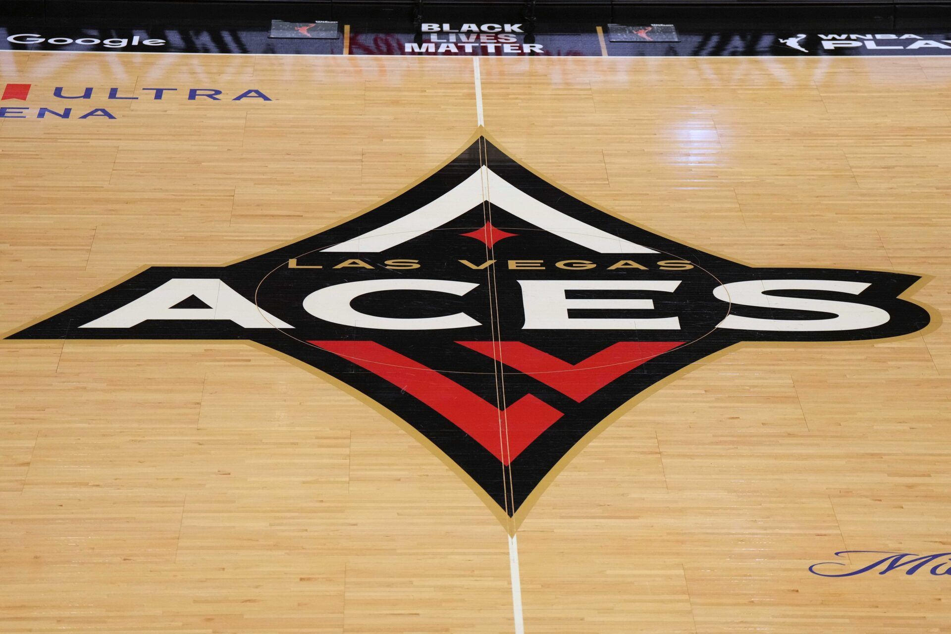 The Las Vegas Aces logo at center court during game one of the 2023 WNBA Semifinals at Michelob Ultra Arena.