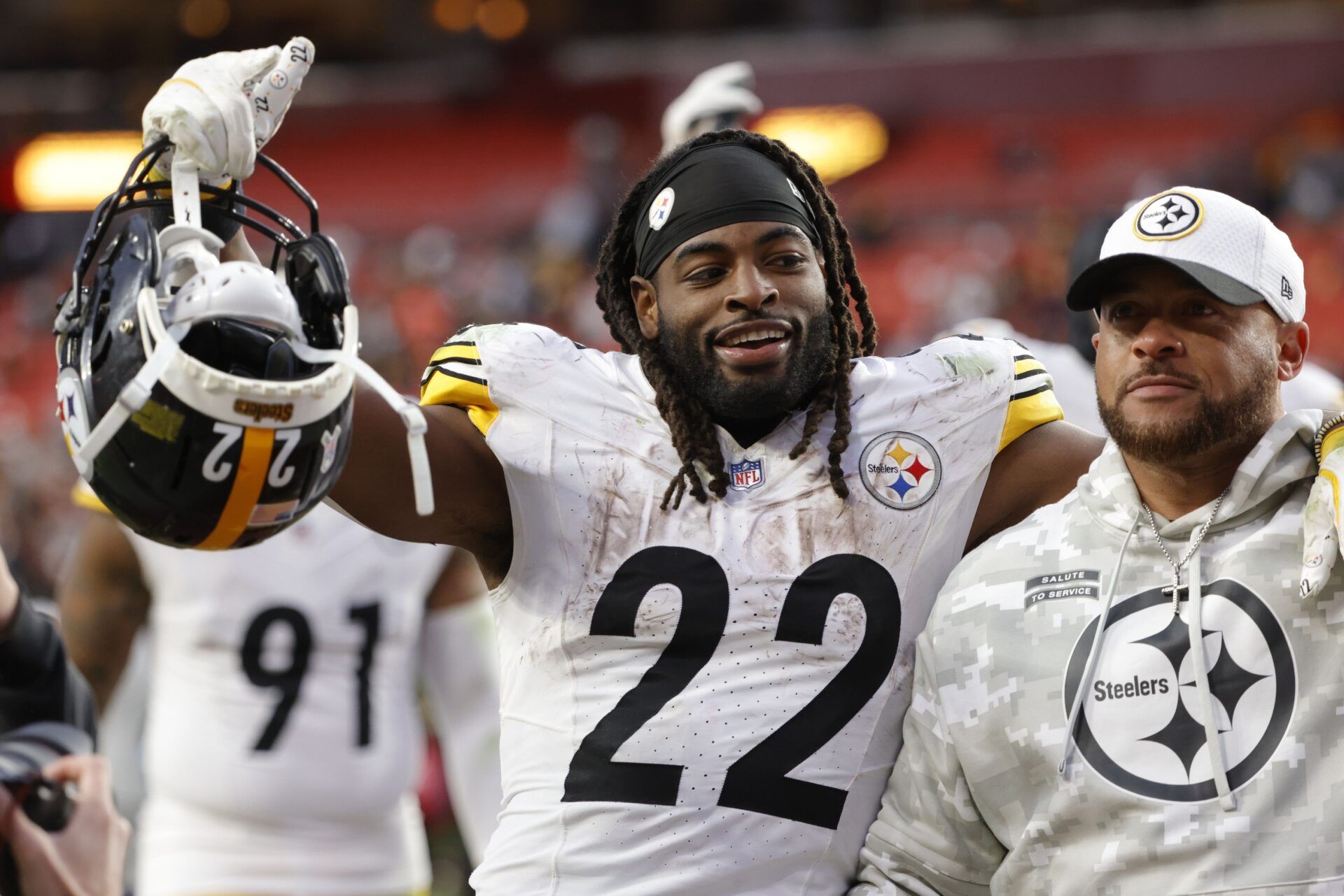 Pittsburgh Steelers running back Najee Harris (22) celebrates while leaving the field after defeating the Washington Commanders at Northwest Stadium.