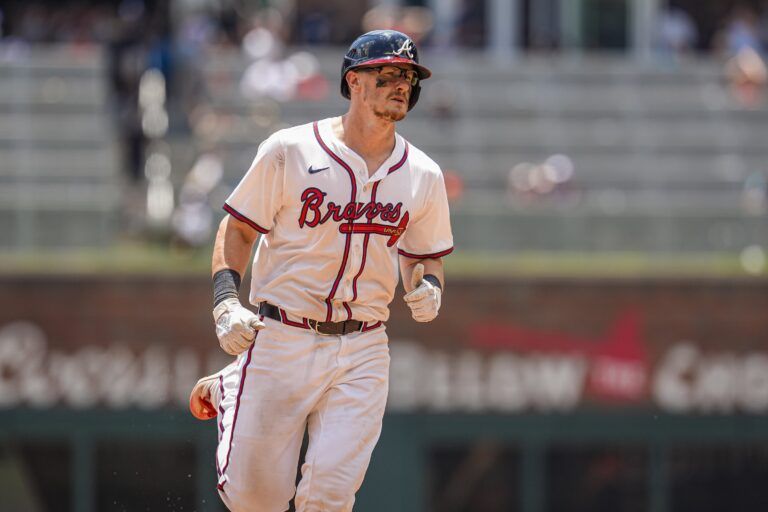 Atlanta Braves catcher Sean Murphy (12) runs after hitting a home run against the Baltimore Orioles during the ninth inning at Truist Park.