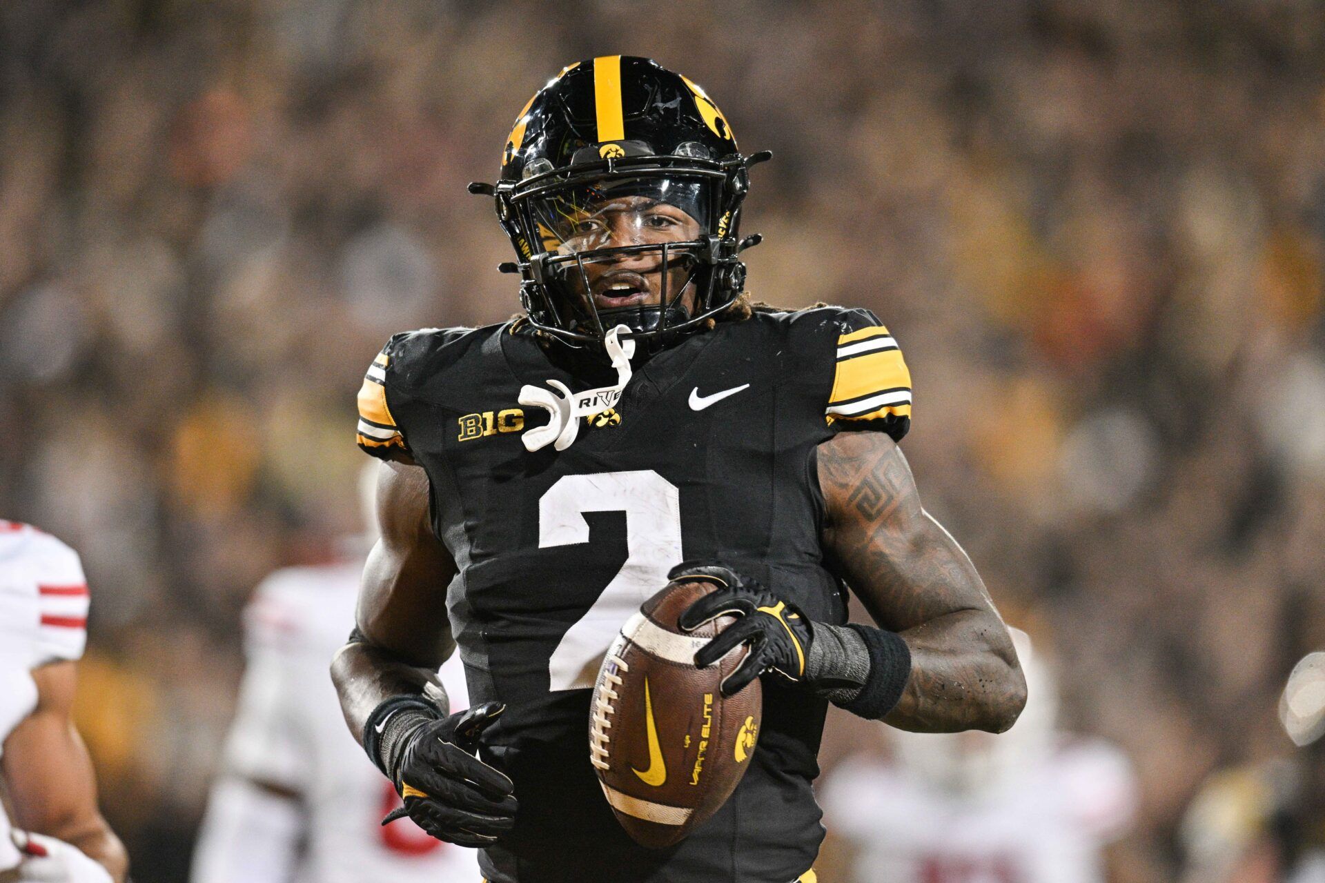 Iowa Hawkeyes running back Kaleb Johnson (2) runs for a 16 yard touchdown against the Wisconsin Badgers during the second quarter at Kinnick Stadium.