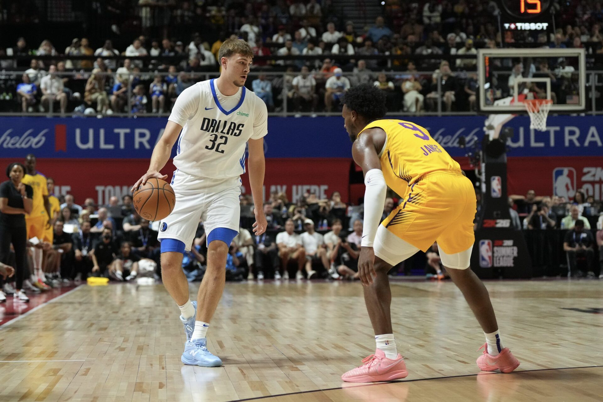 Dallas Mavericks forward Cooper Flagg (32) dribbles against Los Angeles Lakers guard Bronny James (9) in the first quarter of their game at Thomas & Mack Center.