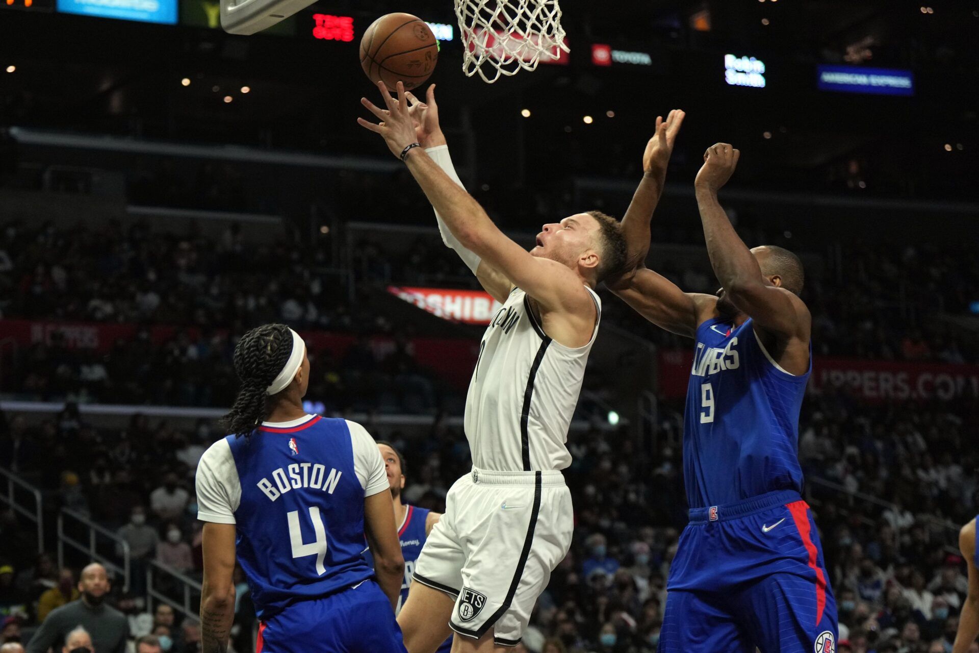 Brooklyn Nets forward Blake Griffin (2) is defended by LA Clippers guard Brandon Boston Jr. (4) and center Serge Ibaka (9) in the second half at Crypto.com Arena.
