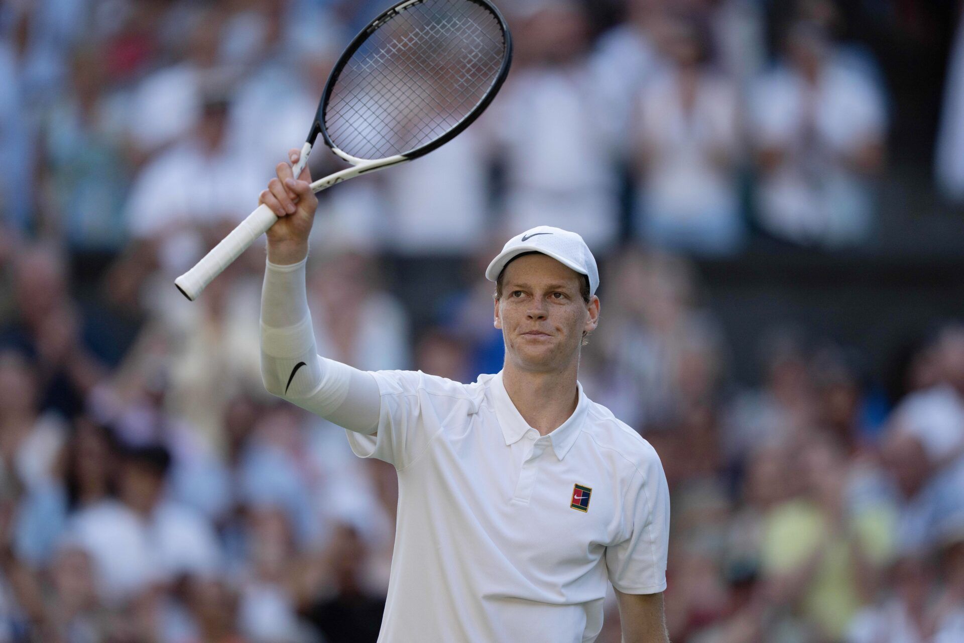 Jannik Sinner of Italy celebrates winning his match against Novak Djokovic of Serbia on day 12 at All England Lawn Tennis and Croquet Club.