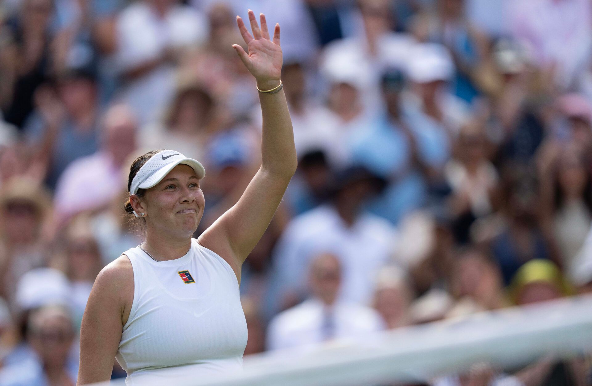 Amanda Anisimova of the United States celebrates winning her match against Aryna Sabalenka on day 11 at All England Lawn Tennis and Croquet Club.