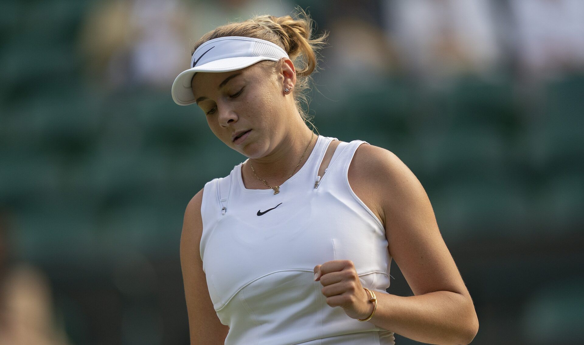 Amanda Anisimova (USA) reacts to a point during her match against Harmony Tan (FRA) on day eight at All England Lawn Tennis and Croquet Club.