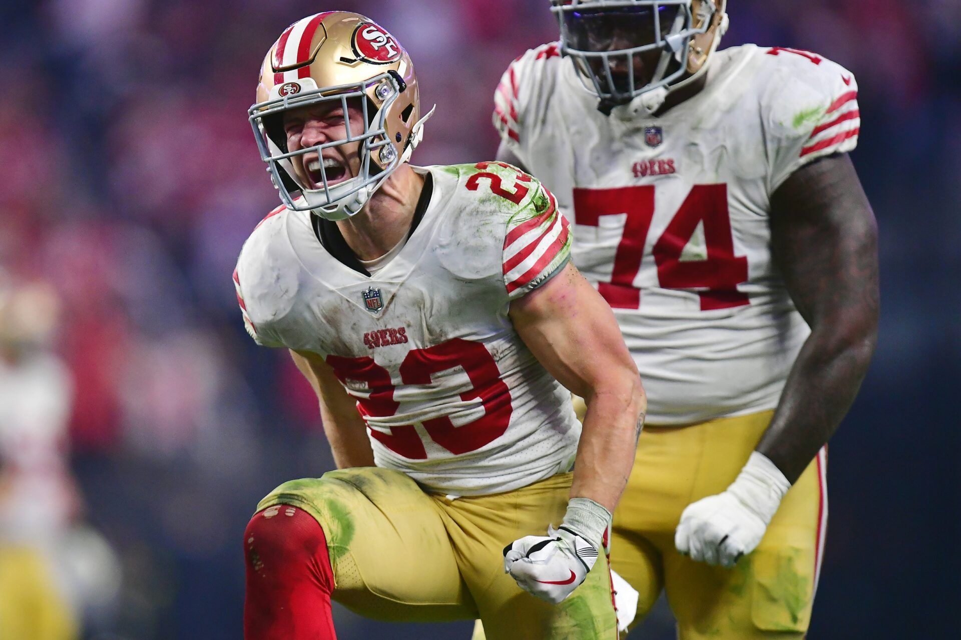 San Francisco 49ers running back Christian McCaffrey (23) reacts after getting first down against the Las Vegas Raiders during the second half at Allegiant Stadium.