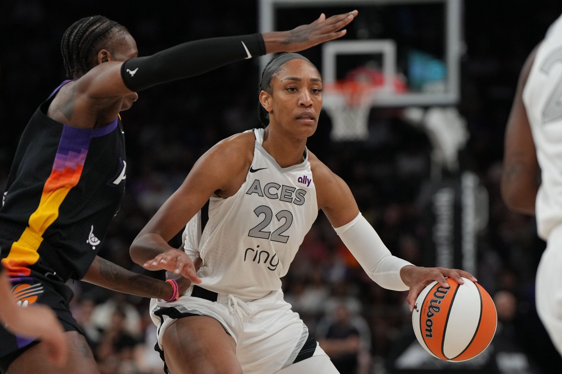Las Vegas Aces center A'ja Wilson (22) drives against the Phoenix Mercury in the first half at Footprint Center.