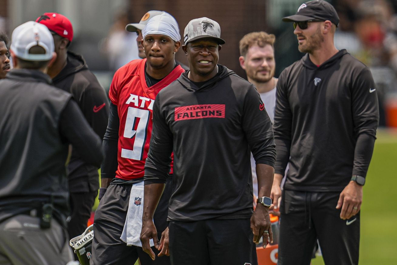 Atlanta Falcons quarterback Michael Penix Jr. (9) and head coach Raheem Morris on the field during Minicamp at Children's Healthcare of Atlanta Training Ground.