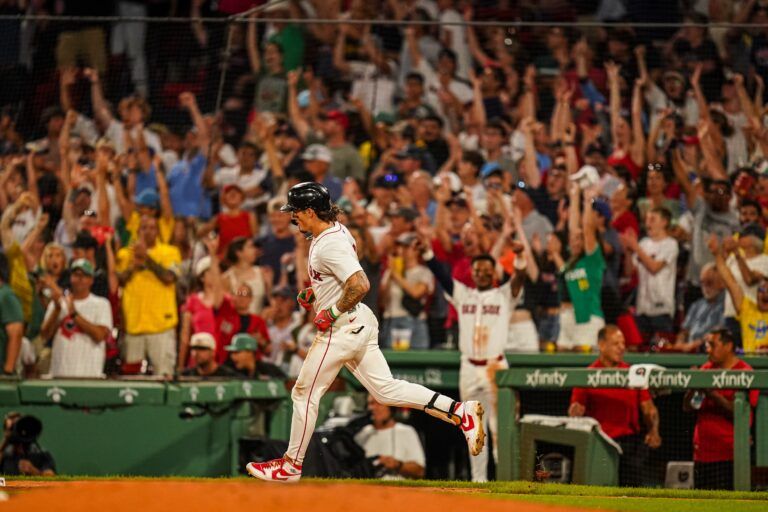 Boston Red Sox outfielder Jarren Duran (16) hits a home run against the Colorado Rockies in the seventh inning at Fenway Park.