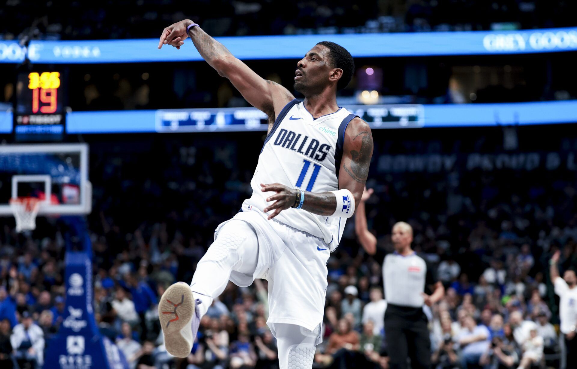 Dallas Mavericks guard Kyrie Irving (11) reacts after shooting against the Charlotte Hornets during the second half at American Airlines Center.