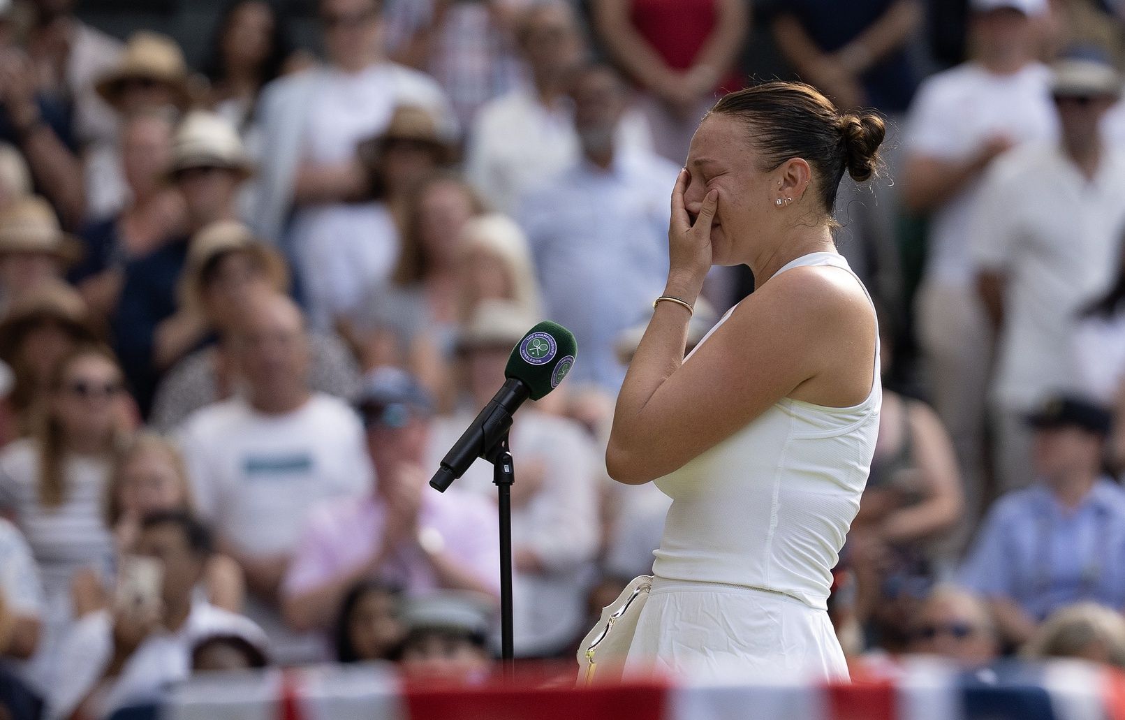 Amanda Anisimova of the United States speaks at the trophy presentation after losing the women’s final match against Iga Swiatek of Poland on day 13 at All England Lawn Tennis and Croquet Club.