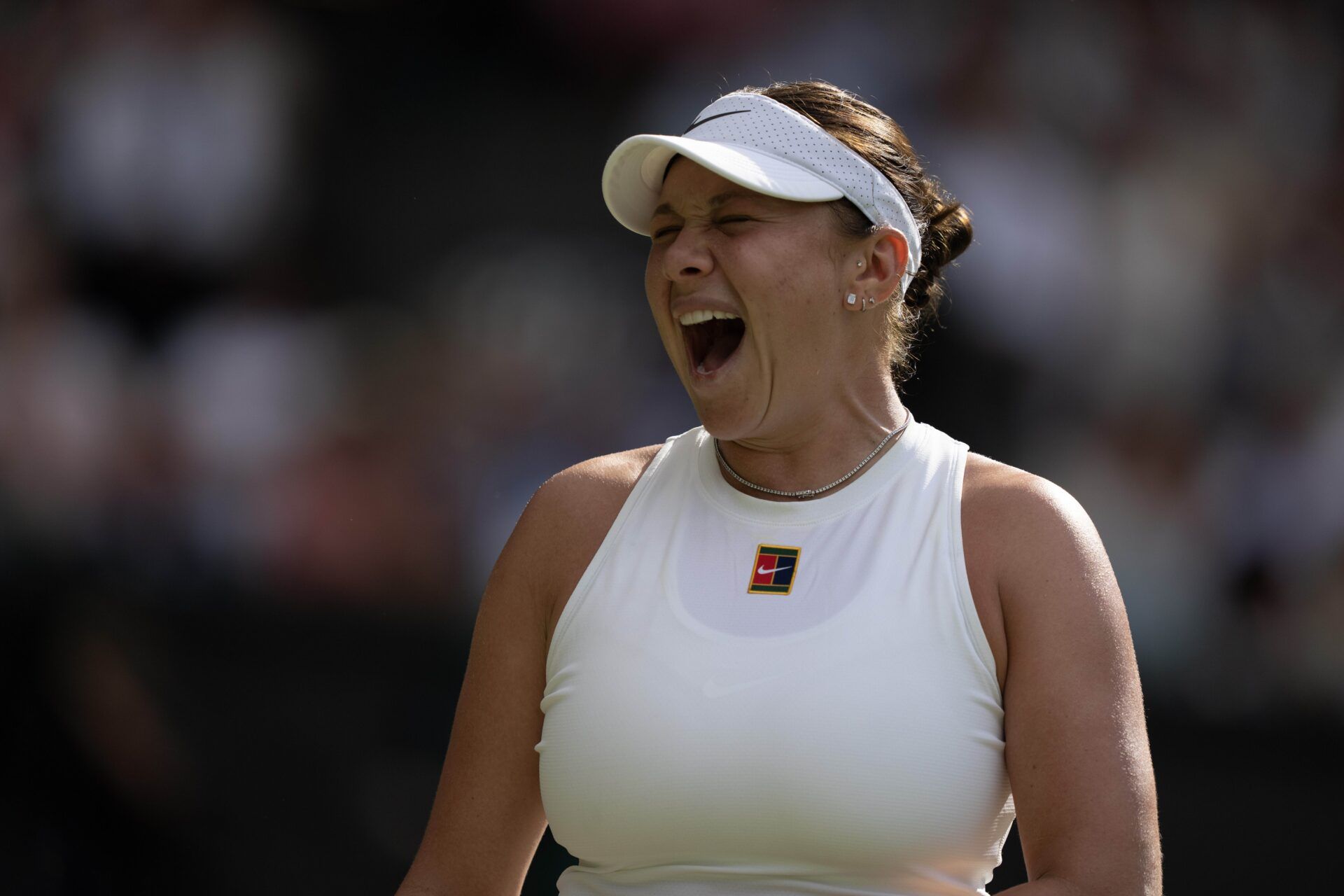 Amanda Anisimova of the United States reacts to a point during the women’s final match against Iga Swiatek of Poland on day 13 at All England Lawn Tennis and Croquet Club.