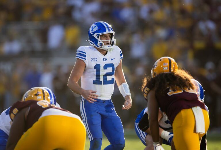 Brigham Young Cougars quarterback Jake Retzlaff (12) against the Arizona State Sun Devils at Mountain America Stadium.