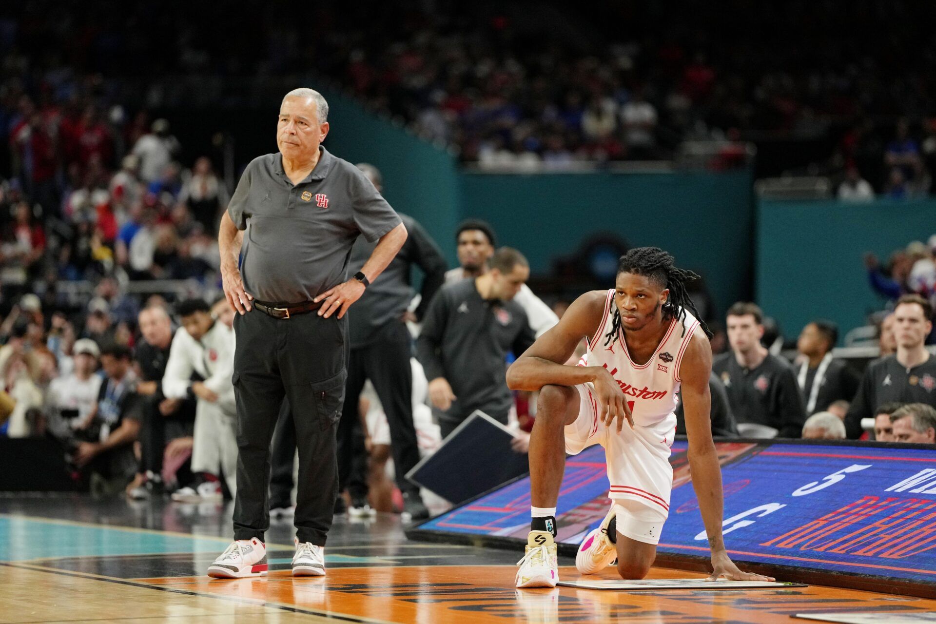 Houston Cougars head coach Kelvin Sampson and forward Joseph Tugler (11) look on against the Florida Gators during the second half of the national championship game of the Final Four of the 2025 NCAA Tournament at the Alamodome.