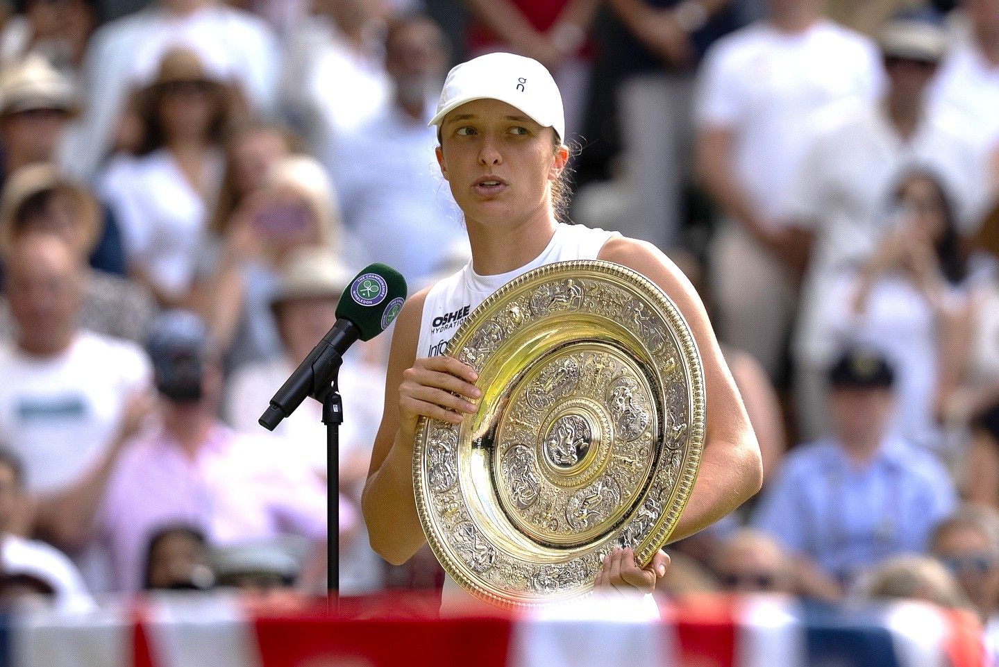 Iga Swiatek of Poland speaks at the trophy presentation after winning the women’s final match against Amanda Anisimova of the United States on day 13 at All England Lawn Tennis and Croquet Club.