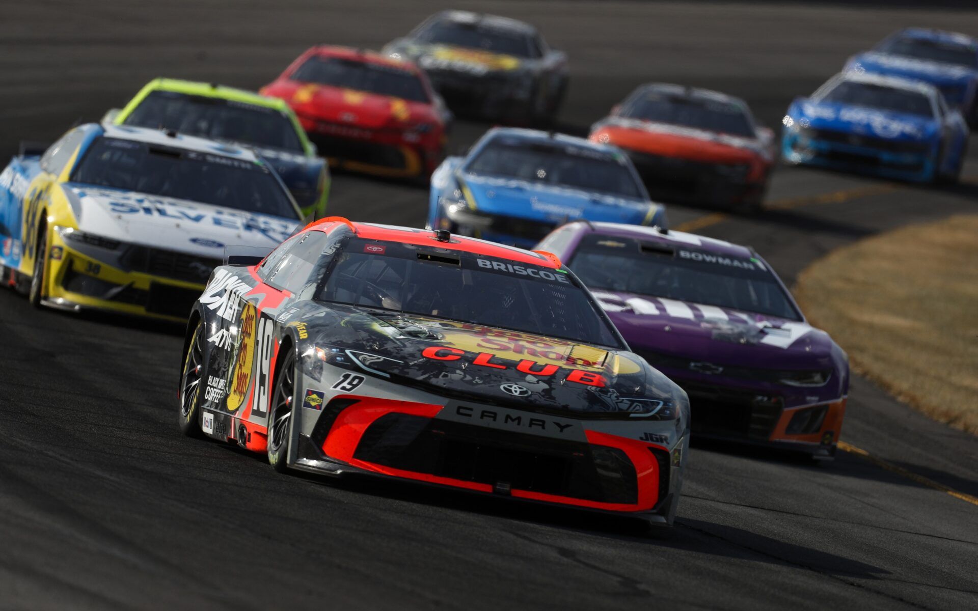 NASCAR Cup Series driver Chase Briscoe (19) leads a pack of cars during The Great American Getaway 400 at Pocono Raceway.