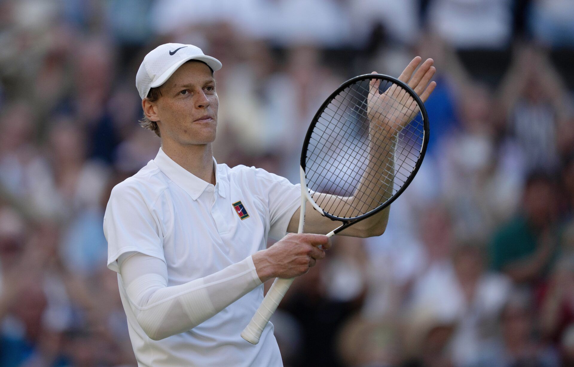 Jannik Sinner of Italy celebrates winning his match against Novak Djokovic of Serbia on day 12 at All England Lawn Tennis and Croquet Club.