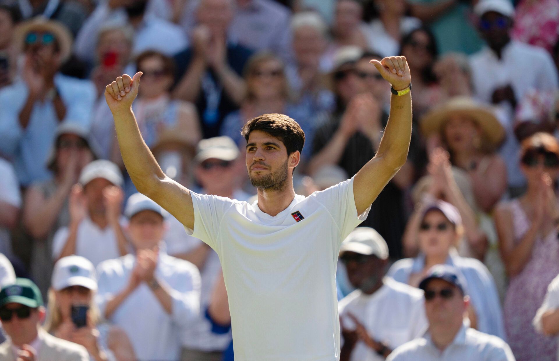Carlos Alcaraz of Spain celebrates winning his match against Taylor Fritz of the United States on day 12 at All England Lawn Tennis and Croquet Club.