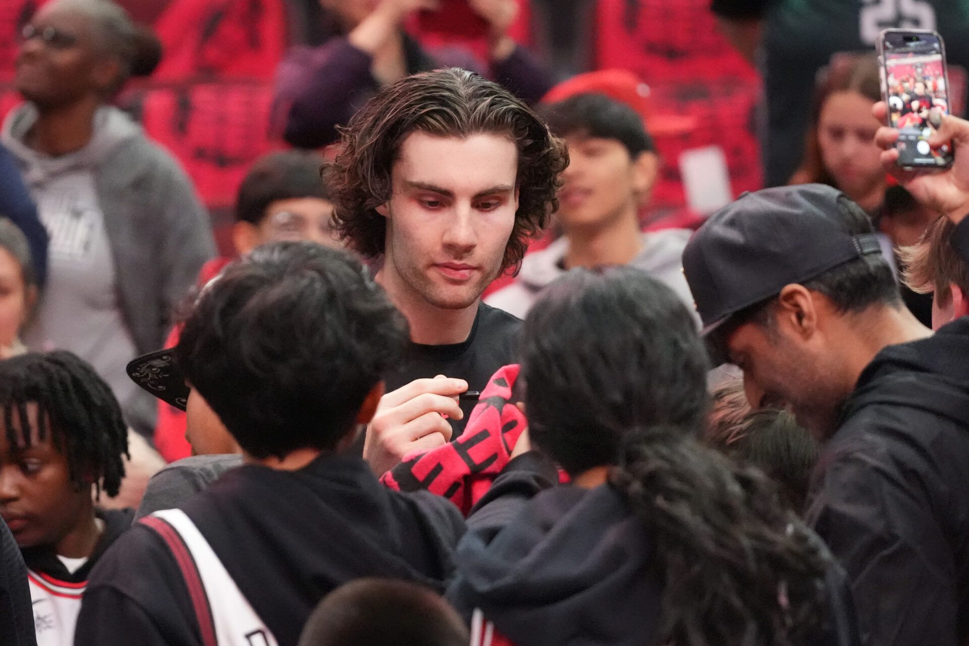 Chicago Bulls guard Josh Giddey (3) signs autographs before the game against the Miami Heat at United Center.