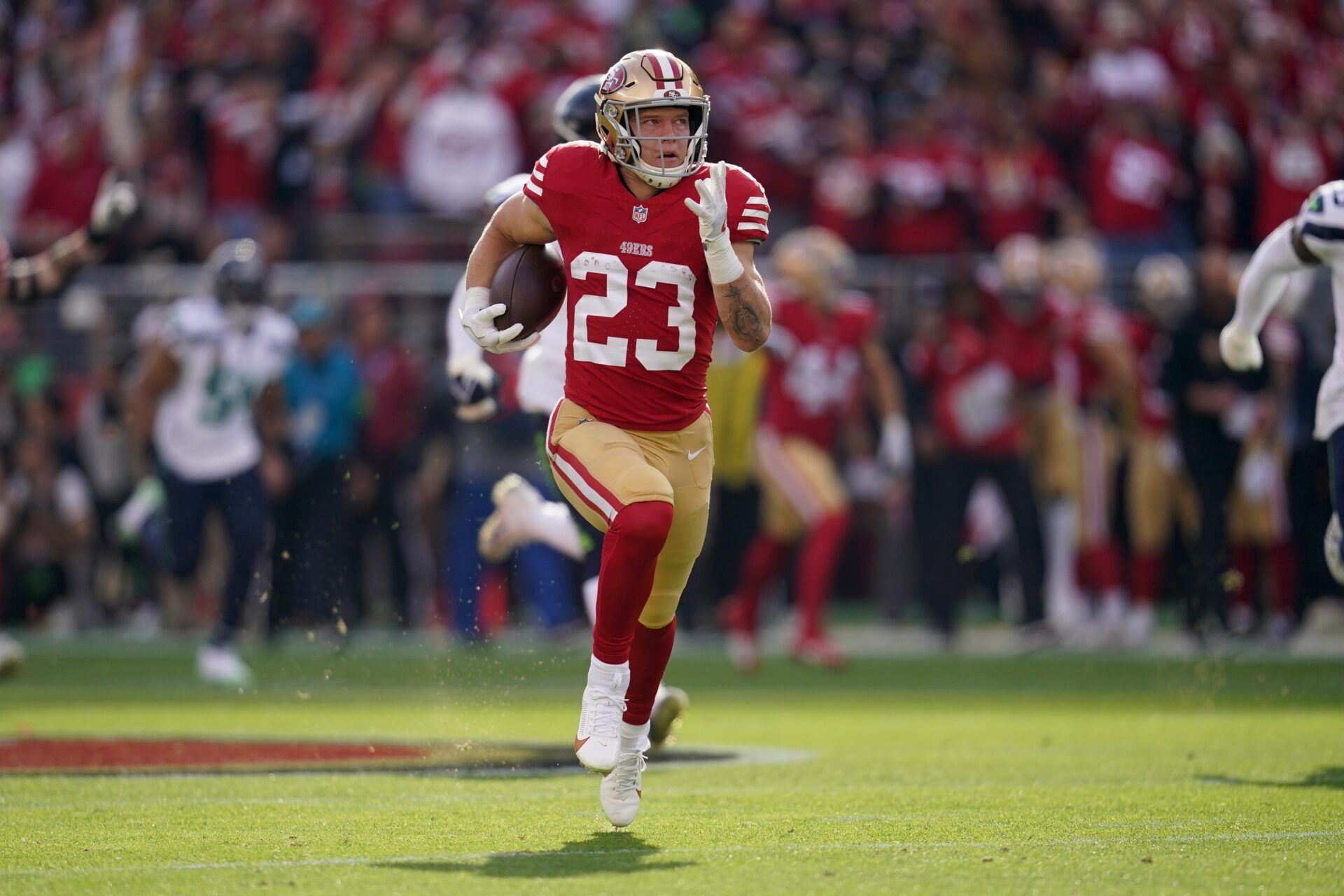 San Francisco 49ers running back Christian McCaffrey (23) rushes for a 72 yard gain against the Seattle Seahawks in the first quarter at Levi's Stadium.