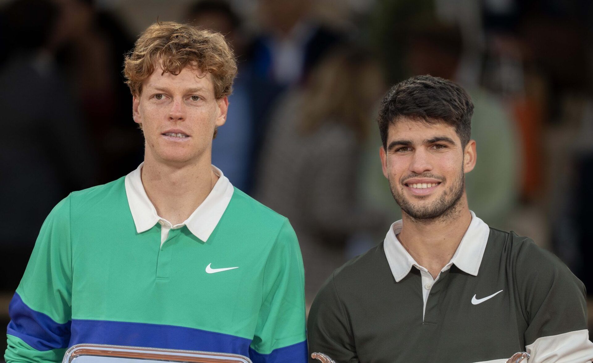 Jannik Sinner of Italy and Carlos Alcaraz of Spain pose together at the trophy presentation after the men’s singles final on day 15 at Roland Garros Stadium.