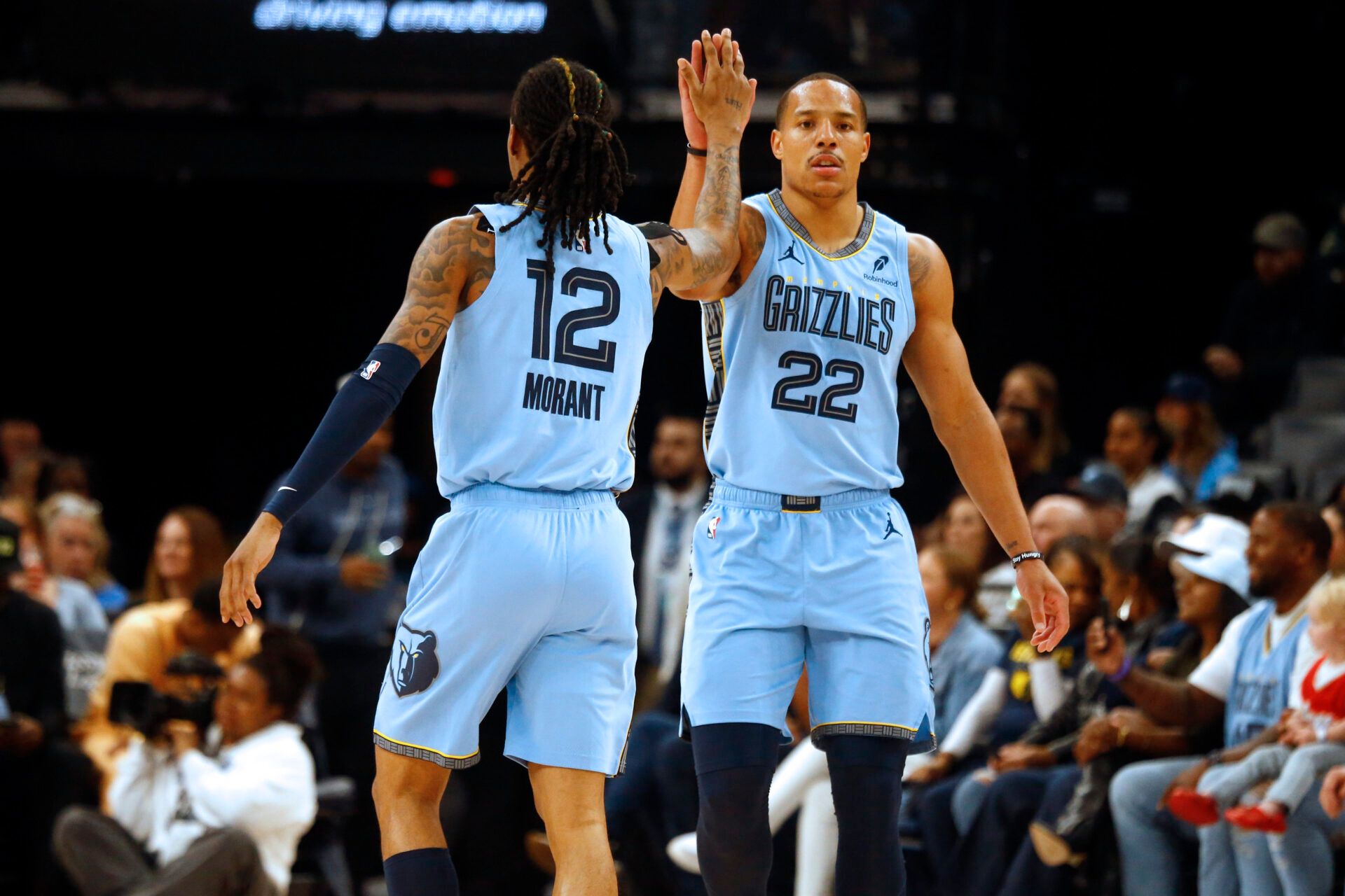Memphis Grizzlies guard Desmond Bane (22) reacts with Memphis Grizzlies guard Ja Morant (12) during the first quarter against the Boston Celtics at FedExForum.