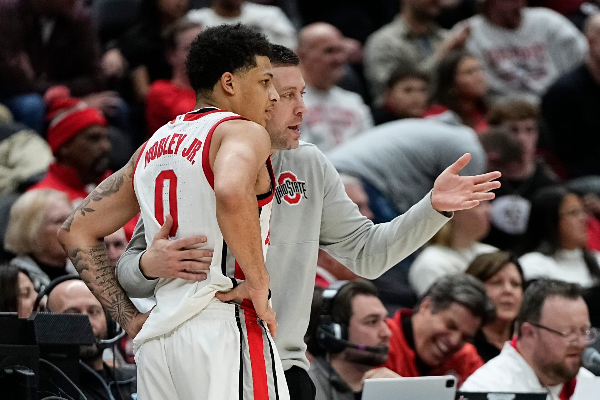 Ohio State Buckeyes head coach Jake Diebler talks to guard John Mobley Jr. (0) during the second half of the NCAA men's basketball game against the Valparaiso Beacons at Value City Arena in Columbus on Dec. 17, 2024. Ohio State won 95-73.