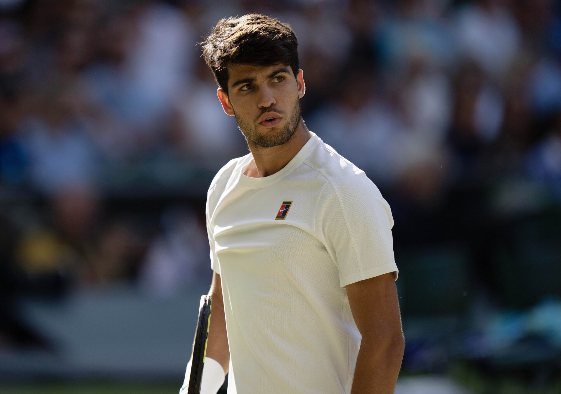 Carlos Alcaraz of Spain reacts to a point during his match against Cameron Norrie of Great Britain on day nine at All England Lawn Tennis and Croquet Club.
