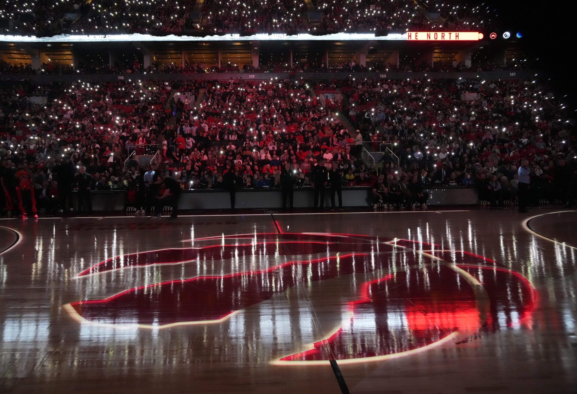 The Toronto Raptors logo lit up on the court before the start of the game against the Minnesota Timberwolves at Scotiabank Arena.